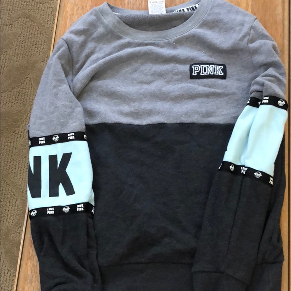 a pink sweater